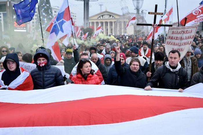 Belarusian protesters march in the capital Minsk against the prospect of closer ties with Russia