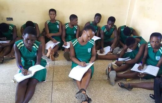 Photos: Lack of furniture forces Ningo SHS students to sit on bare floor to study