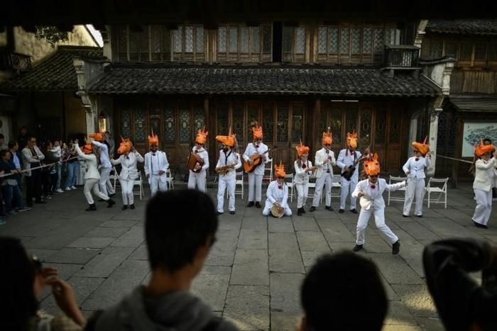 Artists from the Ikarus troupe perform at the Wuzhen Theatre Festival. Wuzhen's government promotes the town as an arts centre, which affords directors a sliver more creative leeway than elsewhere