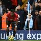 Manchester United's Fred tries to take a corner kick after being pelted with objects from the crowd at Manchester City
