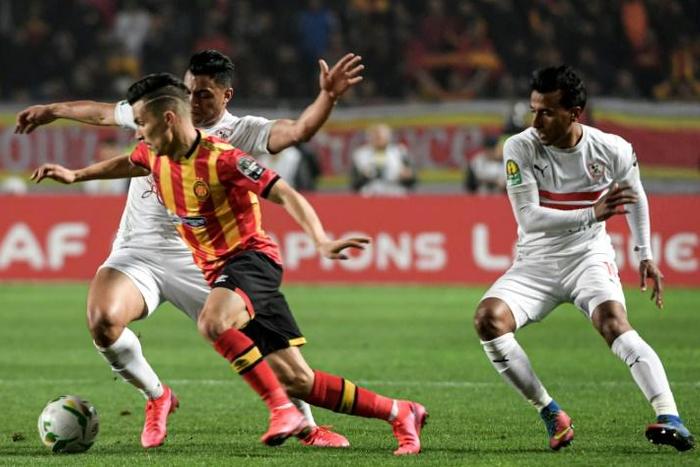 Esperance scorer Billel Bensaha (L) is challenged by Mostafa Mohamed (behind) and Mohamed Abdel Shafy of Zamalek in Tunis