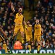 Port Vale striker Tom Pope (C) celebrates after scoring against Manchester City
