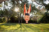 Aubrey Marcus doing acroyoga in his garden at his home in Austin, Texas.