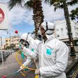 Health ministry workers (pictured March 22, 2020) disinfect the streets of Rabat, the capital of Morocco, where the government has approved the use of hydroxychloroquine to treat the coronavirus