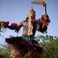 Defiance: A masked man wearing a traditional Dogon costume dances at the opening of the Segou'Art Festival, which takes place despite the threat of jihadist attacks