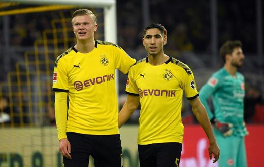 Dortmund forwards Erling Braut Haaland (L) and Achraf Hakimi (R) celebrate Friday's 4-0 win over Eintracht Frankfurt.