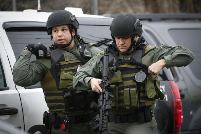 Hundreds of police from New Jersey and New York, including tactical officers armed with rifles and wearing olive-green fatigues, were deployed during the hours-long shootout in Jersey City
