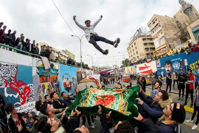 Weeks of deadly demonstrations in Iraq are being recounted nightly by actors in Baghdad's Tahrir Square