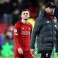 No longer invicible: Liverpool manager Jurgen Klopp (centre) warned the Premier League title race is not over