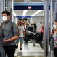 Travelers arrive at the international terminal of O'Hare Airport in Chicago on March 15, 2020