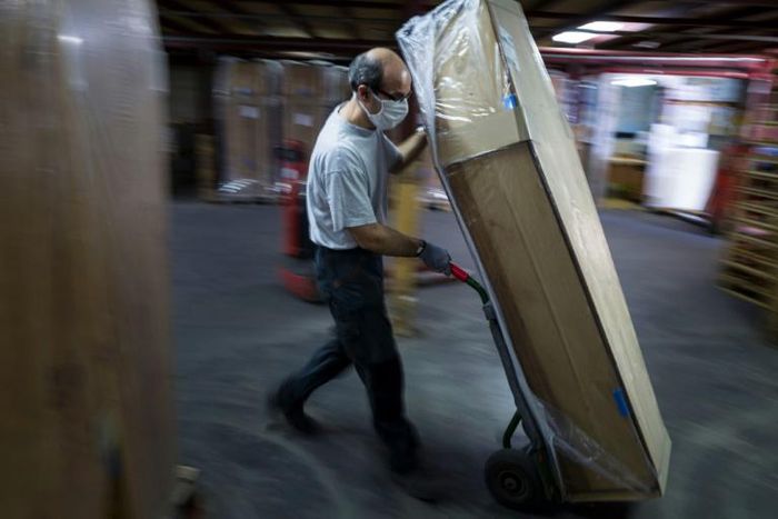Employees at  coffin-maker OGF have little time to stand still as orders are up thanks to the coronavirus pandemic