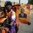 Canine backing: Supporters of opposition candidate Jean-Pierre Fabre, champion of the National Alliance for Change party