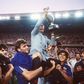 (FILES) Michel Hidalgo,  carried by several France players, holds aloft the European Championship trophy after their 2-0 win over Spain in the final in 1984