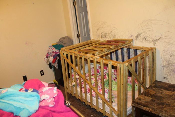 Mother, grandmother and grandfather accused of locking children in wooden cages