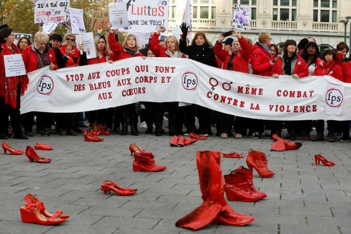 Protesters placed red shoes on the ground as a symbol of the victims of violence against women