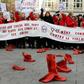Protesters placed red shoes on the ground as a symbol of the victims of violence against women