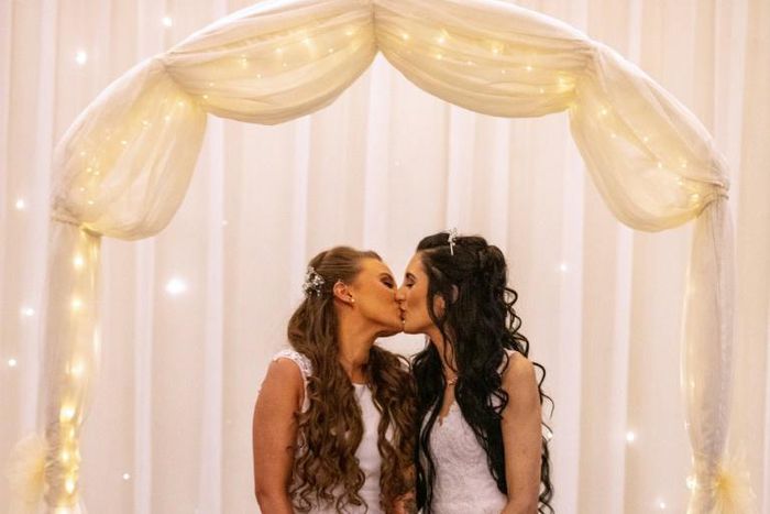 Robyn Peoples (L) and Sharni Edwards (R) tied the knot at a hotel near Belfast, after the new legislation came into effect on Monday