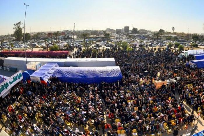 Protesters gather outside Kufa University in the central Iraq on Sunday