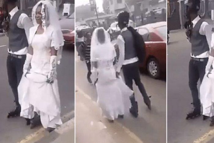 Newly-wedded couple falls flat as groom shows of his skating prowess (video)