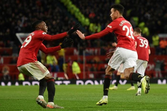 Manchester United forward Mason Greenwood (right) celebrates his equaliser against Everton