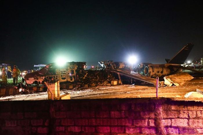 The burnt out shell of an aircraft that caught fire at Manila airport late Sunday