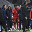 Kingsley Coman (C) was helped off after hurting his knee in Wednesday's 3-1 home win over Tottenham in the Champions League