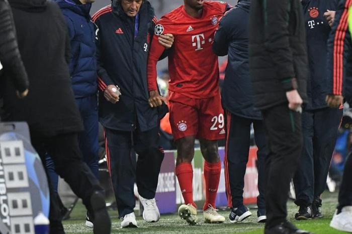 Kingsley Coman (C) was helped off after hurting his knee in Wednesday's 3-1 home win over Tottenham in the Champions League