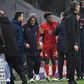 Kingsley Coman (C) was helped off after hurting his knee in Wednesday's 3-1 home win over Tottenham in the Champions League