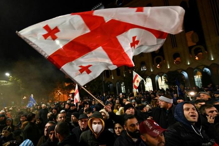 Opposition supporters have staged a series of mass rallies in the capital Tbilisi after the ruling party voted down legislation to hold next year's elections under a new proportional voting system