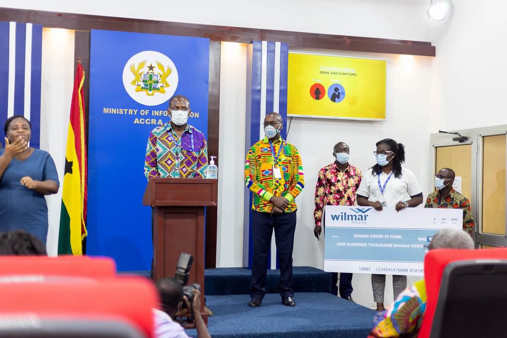 General Manager of Wilmar Africa, Kwame Wiafe speaking at the press briefing with Head of Marketing, Patience Mpereh holding the dummy cheque