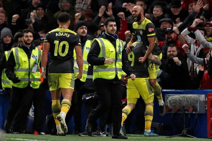Jump for joy - Nathan Redmond (up) celebrates scoring their second goal in a 2-0 win away to Chelsea