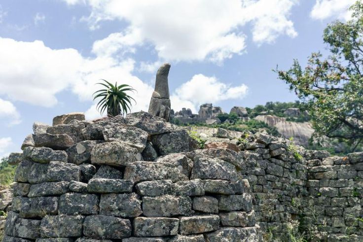 A carved bird in standstone temporarily left an on-site museum to take up its rightful place in the Great Zimbabwe ruins, symbol of an African culture