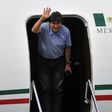 Bolivian ex-President Evo Morales waves upon landing in Mexico City, on November 12, 2019, where he was granted exile after his resignation