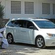 Priest Marco Antonio Galeana hears confession from a penitent in a car in Acapulco, Mexico
