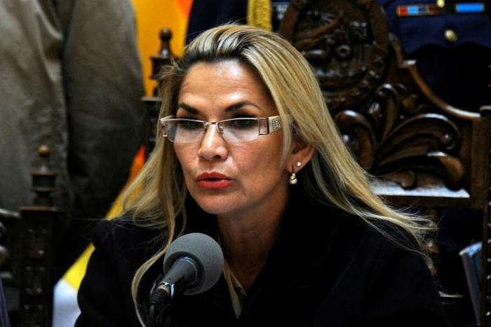 Bolivia's interim president Jeanine Anez (pictured November 23, 2019) signed a bill for new elections, vowing the process would be "clean, just and transparent"