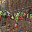 Ethiopian workers stand on scaffolding in 2015 during the construction of the Grand Renaissance Dam