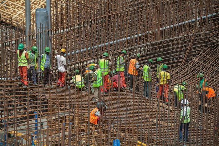 Ethiopian workers stand on scaffolding in 2015 during the construction of the Grand Renaissance Dam