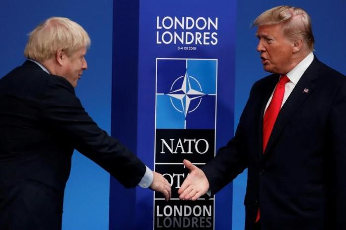 Arriving for the formal NATO talks on Wednesday, Boris Johnson denied he was trying to avoid being seen with Donald Trump
