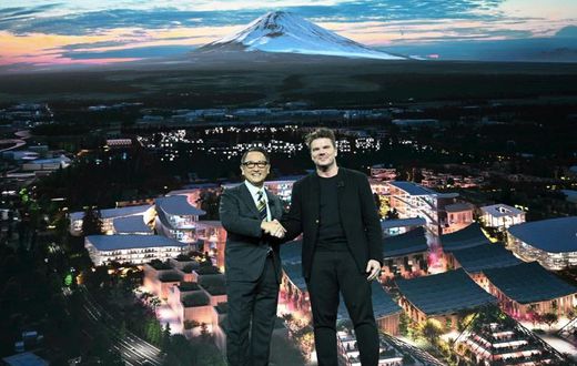 Toyota President and CEO Akio Toyoda (L) and Danish architect Bjarke Ingel reveal plans for a prototype "city" of the future at the base of Mt. Fuji in Japan during the Toyota press conference at the 2020 Consumer Electronics Show