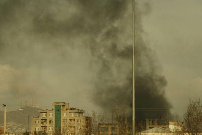 Smoke rises from the site of the gun attack in Kabul on Friday
