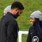 Defender Joe Gomez (left) and forward Raheem Sterling attend an England team training session on November 12, 2019
