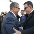 A handout picture released by the official Algeria Press Service (APS) on January 6, 2020 shows Algeria's Prime Minister Abdelaziz Djerad (L) receiving Libya's UN-recognised Prime Minister Fayez al-Sarraj upon his arrival in Algiers