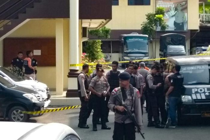 Indonesian police at their headquarters in Medan after the suspected suicide attack