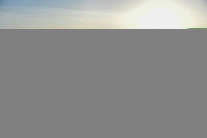 A boy floats on the Amazon river in Macapa, the starting point for the Anna Karoline III's journey