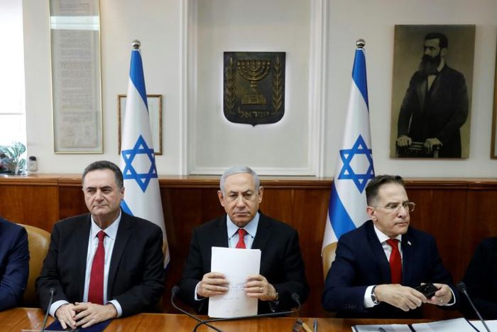 Flanked by cabinet members, Israeli Prime Minister Benjamin Netanyahu warns Palestinian militant group Islamic Jihad it will have to "absorb more and more blows" if it keeps up its rocket fire into Israel