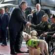 US Secretary of State Mike Pompeo (L) shakes hands with Colombian policemen victims of landmines during his visit at an anti-drug base in Bogota