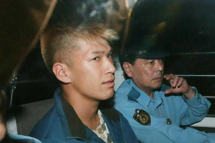 Satoshi Uematsu, charged with murdering 19 disabled people at a care home he used to work at, being moved by police shortly after his arrest in 2016