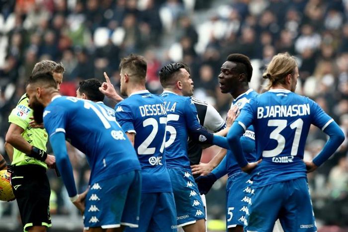 Brescia players, including Mario Balotelli, argue with the referee during a game at Juventus on February 16 in Turin