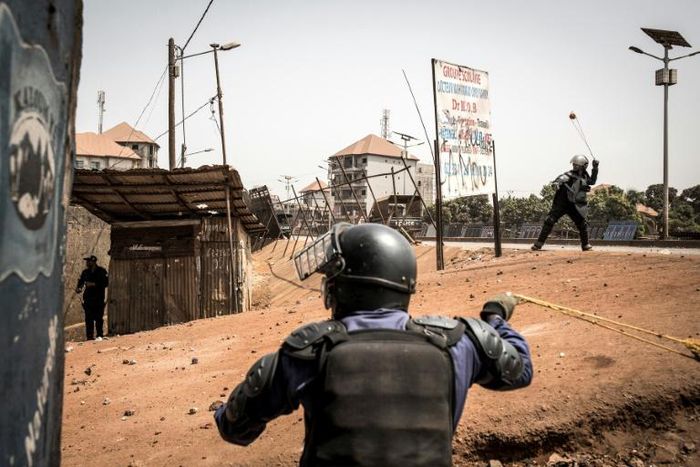 Policemen fired slingshots as an anti-Conde demonstration in Conakry last month turned violent