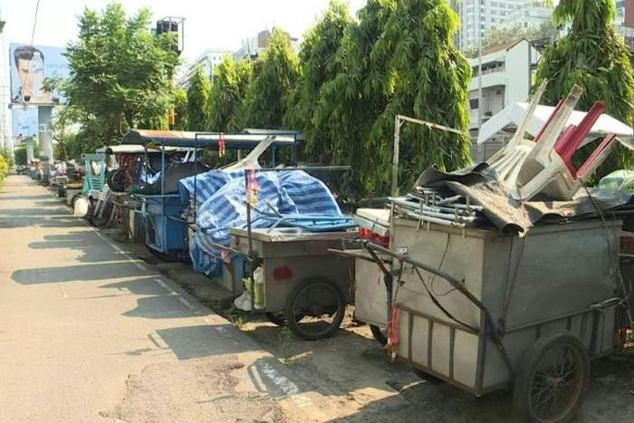 Empty food carts with chairs stacked on them sit in a lot next to a busy Bangkok highway -- the latest casualty of a deadly coronavirus which has stunted global travel and economies.